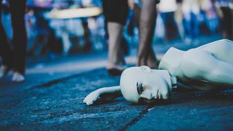 human Mannequin Lying Down Street