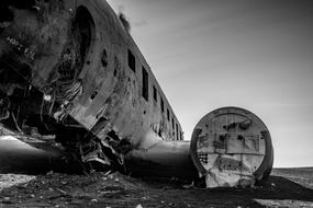 black and white photo of a destroyed military aircraft in Iceland