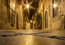 narrow evening city street in Greece