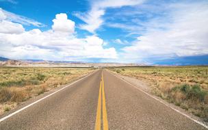 concrete highway among endless prairies