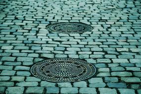 manhole covers on pavement