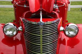 grill and head lights of oldtimer Chevrolet Car close up