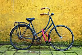 retro bike near yellow wall