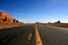 empty asphalt road through rocky red desert, Usa, nevada