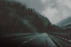 highway over the bridge in the fog in the mountains