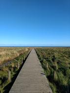 wooden flooring on the road to the sea on the island of Sylt