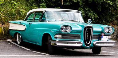 green Edsel oldimer car parked outdoor