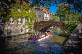 stone bridge over a canal in belgium