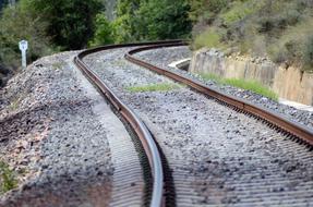 rails in the mountains on a sunny day