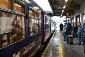 people on the platform near the train