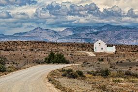 photo of a white building in the desert
