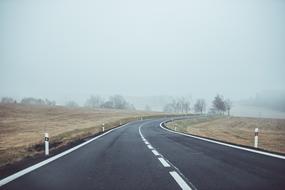 photo of paved road for travel