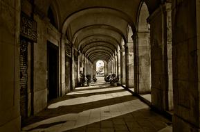 monochrome photo of arched architecture in european city