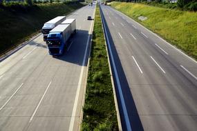 trucks driving on a freeway road