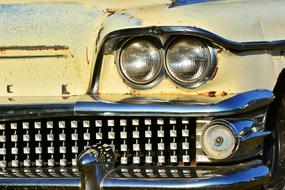 round headlights of an old american car