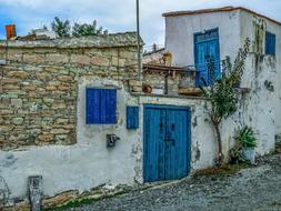 old building with blue shutters in the Pentacomo village, Cyprus