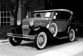 Vintage Car parked at entrance to building