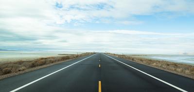 wide highway along the sea