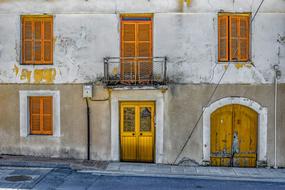 Beautiful and colorful, old house with the balcony, windows and doors in Mazotos, Cyprus, Greece