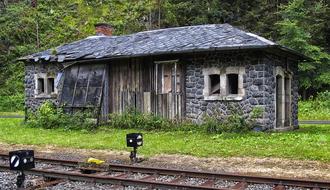 abandoned train station in the woods