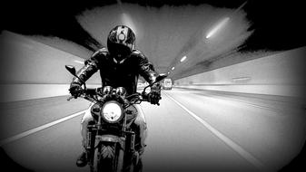 man Speeding Motorcycle in tunnel