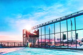 scenic landscape is reflected in the glass facade of modern architecture