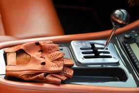 leather driving gloves in Interior of Ferrari Car