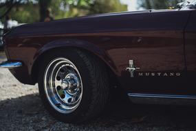 photo of wheel and front fender of a mustang car