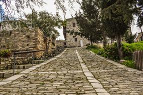 Traditional stone buildings along cobblestone Street, cyprus, vavla