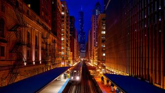 train on railway station in city at night, usa, Illinois, Chicago