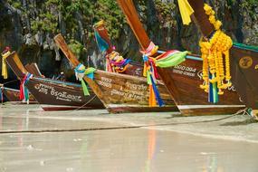 tourist wooden boats at the beach in Thailand