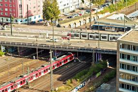 photo of the intersection of railway tracks and a tram bridge in the city