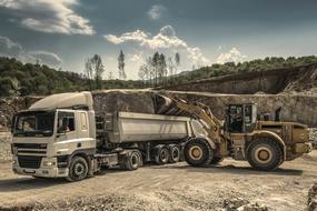 digger and semi-trailer truck