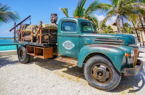 oldtimer ford Truck on beach, Mexico, cozumel