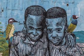 graffiti with the image of two dark-skinned boys