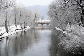 landscape of the river in snowy forest at winter