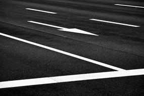 white road markings on black asphalt