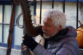 Street musician artist with white hair