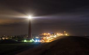 panoramic view of the lighthouse and city at night