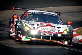 Colorful and beautiful, shiny "Ferrari" racing car, on the road, in sunlight