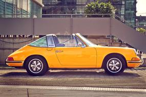 yellow retro porsche 911 convertible car
