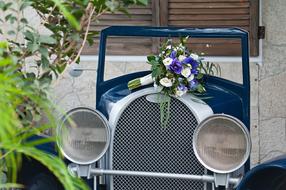 wedding bouquet on a retro car