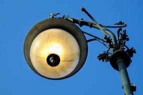 Colorful street eye lamp at blue sky background in Berlin, Germany