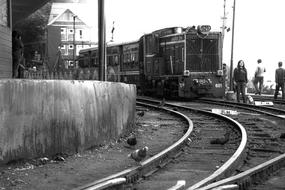 Black and White photo of Train on Rail Line