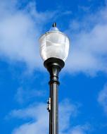 Street Lamp against a blue sky with white clouds