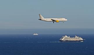 Landing airplane and Cruise Ship on sea, france, nice