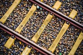 Colorful stones among the track bed with number "m92"