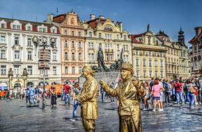 living golden statues in the historic streets of Prague