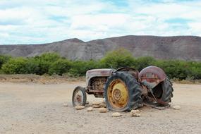 old abandoned tractor in the field