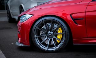 closeup photo of Bmw M3 red car